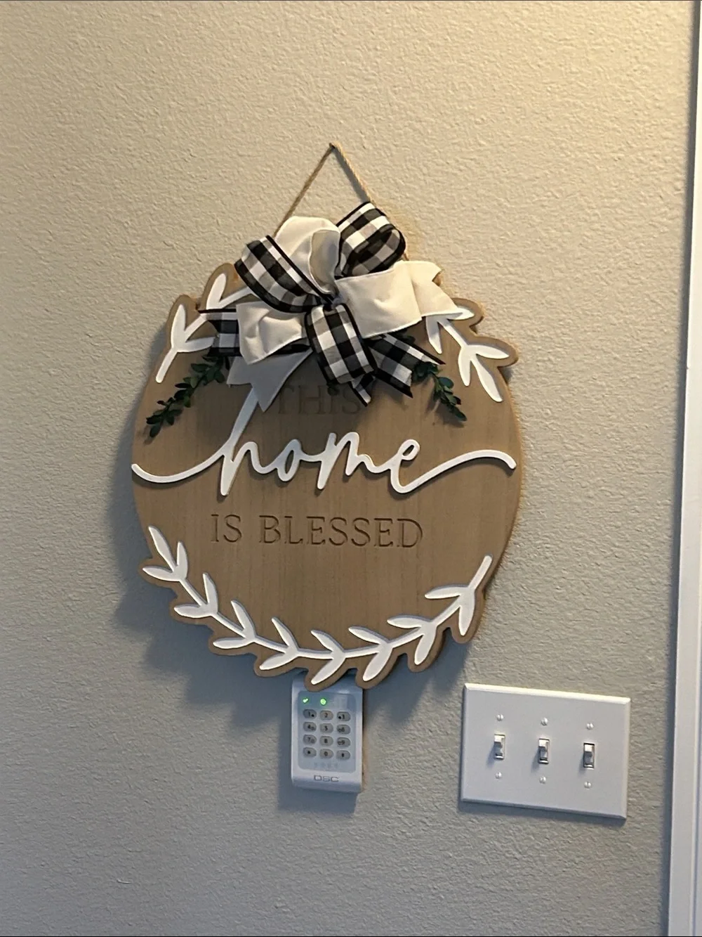 'This Home Is Blessed' Wood Wall Sign with Black Buffalo Check Bow